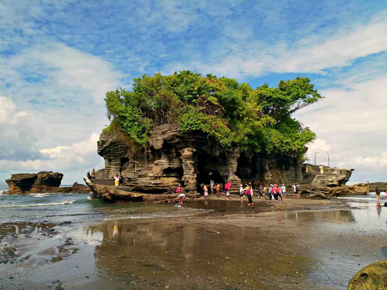 When the tide is low, visitors can simply walk to the temple.