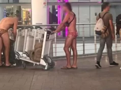 The tourist wore only swimwear at Phuket Airport